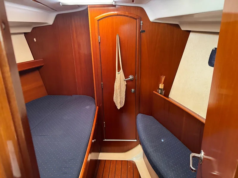 Slide: The Image of Cozy cabin interior of 2002 Beneteau Oceanis Clipper 393 sailboat with wooden finish. - 4