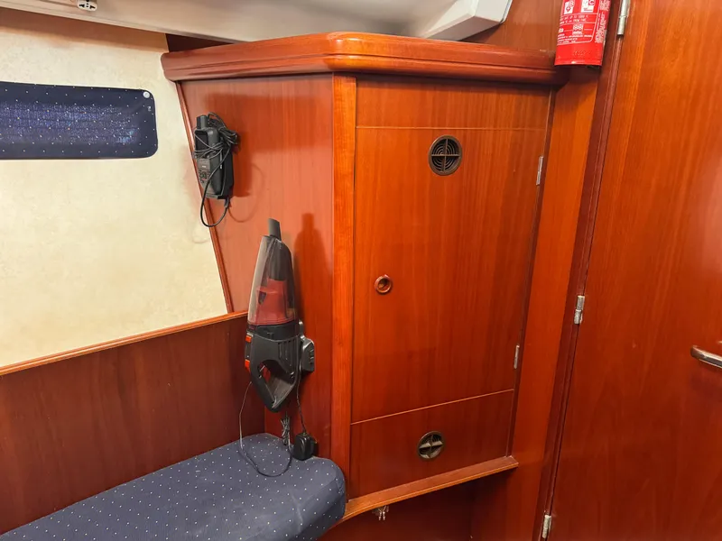 Slide: The Image of Interior of 2002 Beneteau Oceanis Clipper 393 with wooden cabinetry and seating. - 6