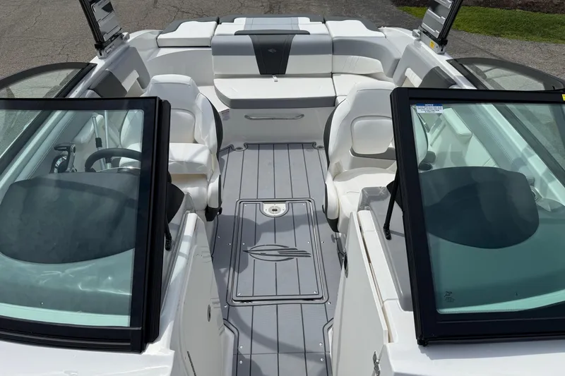 Slide: The Image of 2025 Chaparral 23 SSi boat interior with sleek seating and modern design. - 5