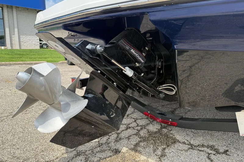 Slide: The Image of 2025 Chaparral 23 SSi boat with MerCruiser outdrive and dual propellers. - 9