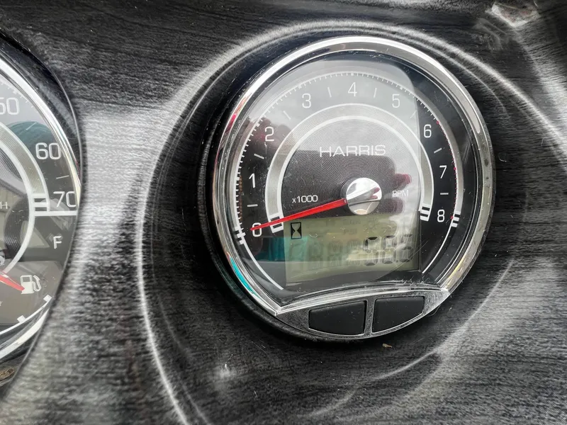 Slide: The Image of Close-up of 2022 Harris Cruiser 230 dashboard tachometer displaying RPM. - 14