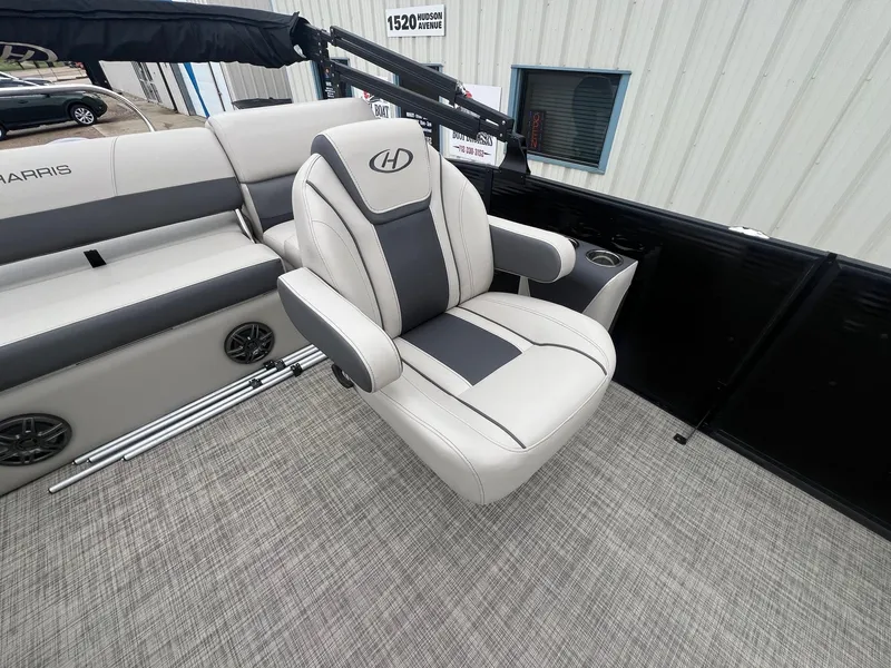 Slide: The Image of 2022 Harris Cruiser 230 boat interior with plush seating and modern design. - 19