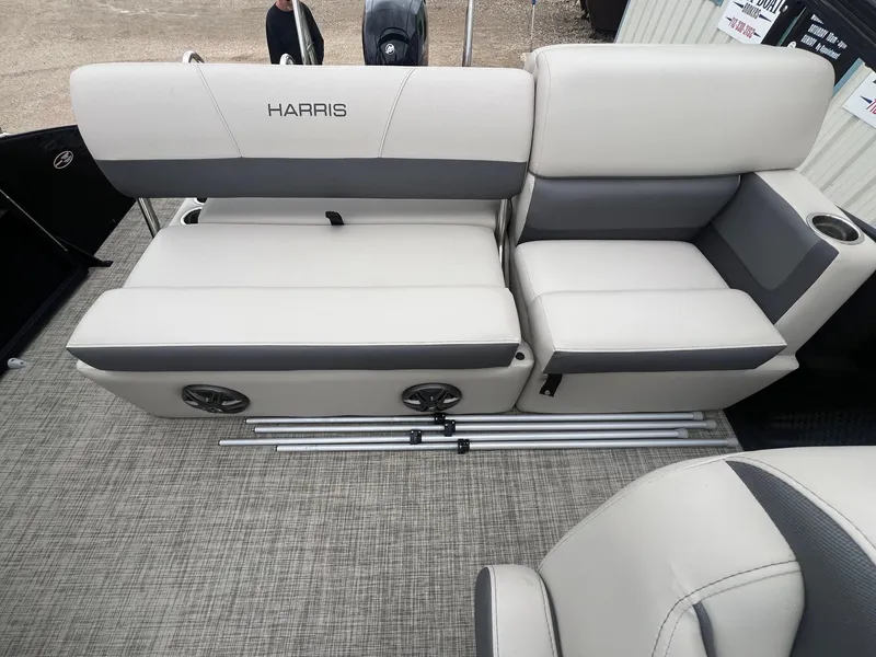 Slide: The Image of 2022 Harris Cruiser 230 boat interior with gray seating and cup holders. - 20