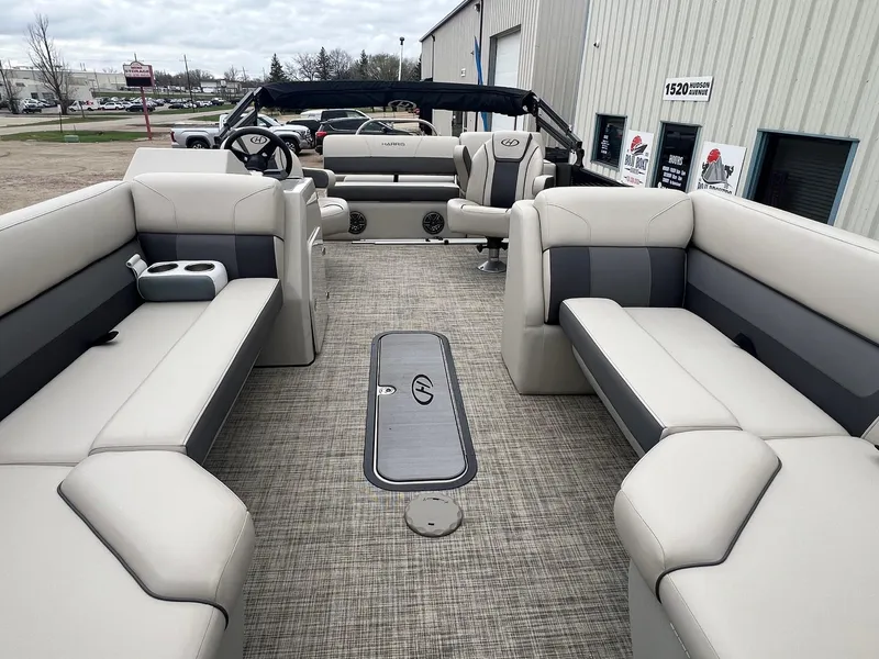 Slide: The Image of 2022 Harris Cruiser 230 pontoon boat interior with spacious seating and modern design. - 3