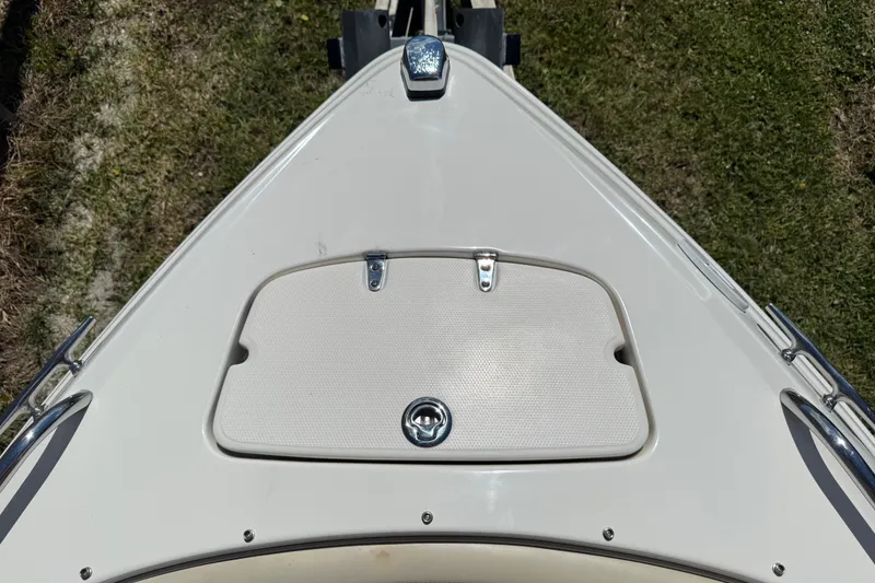 Slide: The Image of Bow of 2004 Chaparral 260 SSi boat with storage compartment. - 21
