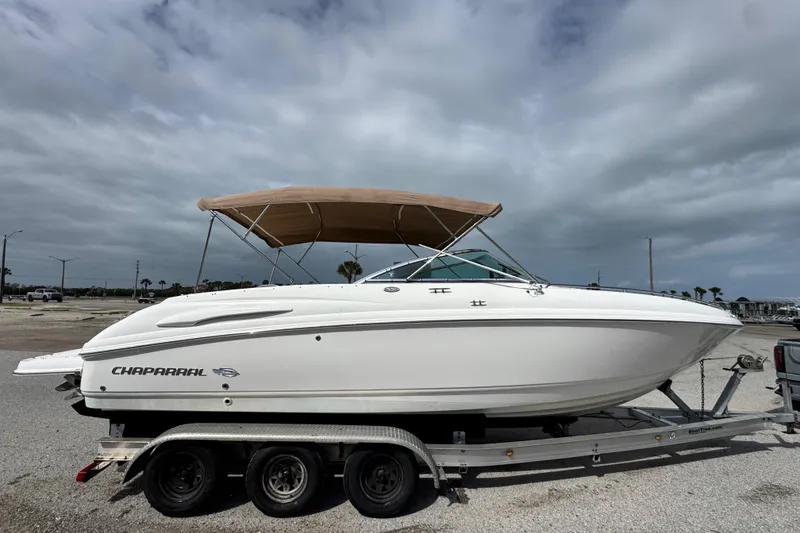 Slide: The Image of 2004 Chaparral 260 SSi boat on trailer, for sale under clear blue sky. - 30