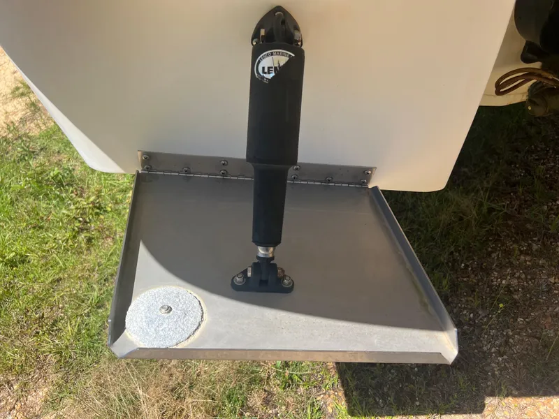 Slide: The Image of Trim tab of a 2013 Monterey 260 SCR boat on grass. - 12