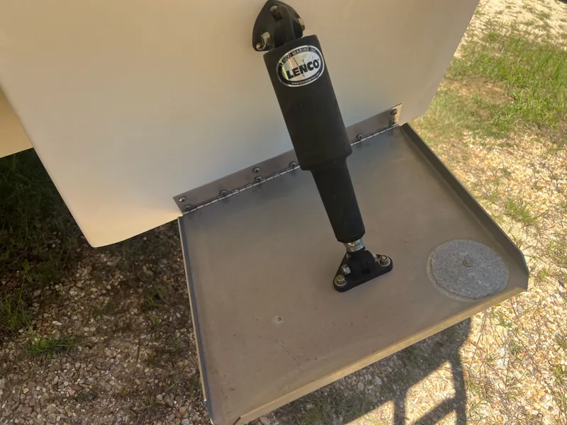 Slide: The Image of Trim tab of a 2013 Monterey 260 SCR boat with Lenco actuator. - 13