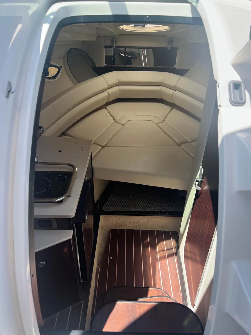 Slide: The Image of 2013 Monterey 260 SCR cabin interior with seating and kitchenette. - 19