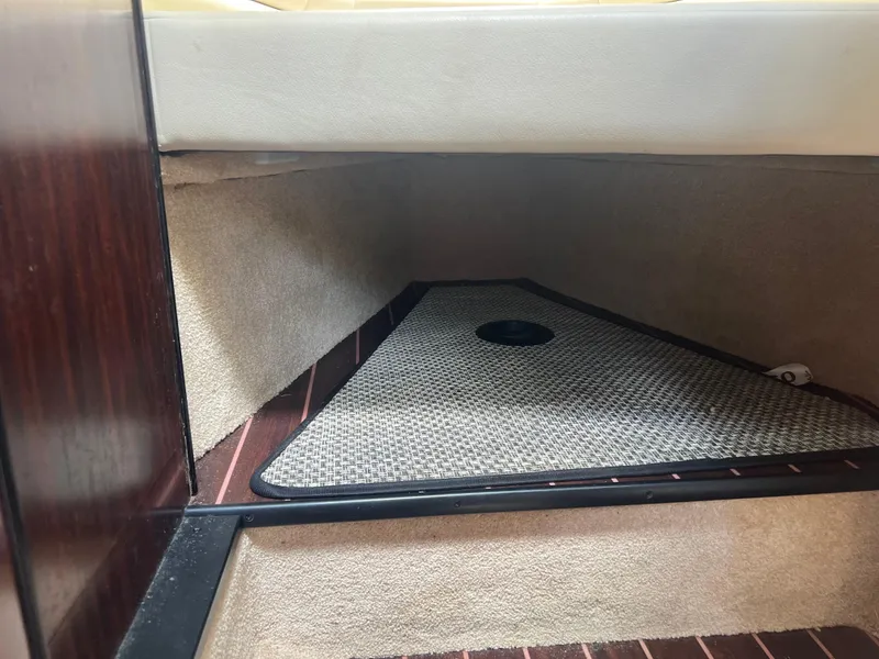 Slide: The Image of Interior cabin space of a 2013 Monterey 260 SCR boat, featuring carpeted flooring. - 25