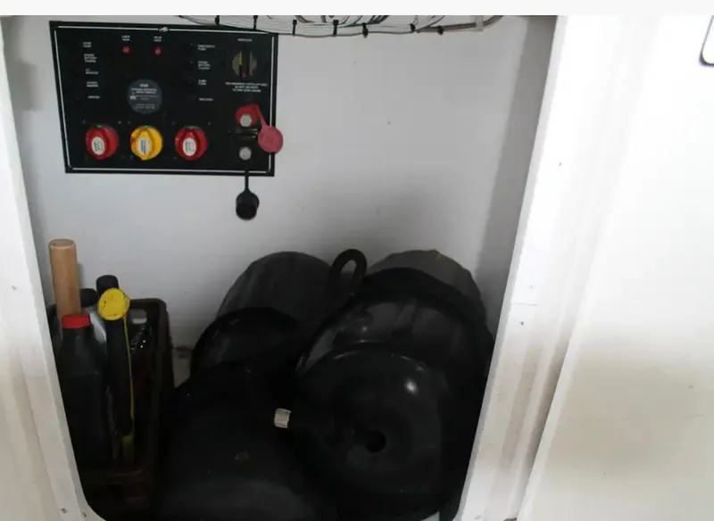 Slide: The Image of Storage compartment in a 2013 Monterey 260 SCR boat with control panel and equipment. - 36