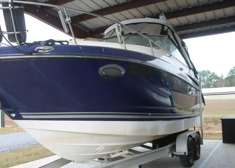 Slide: The Image of 2013 Monterey 260 SCR boat on trailer under shelter. - 4