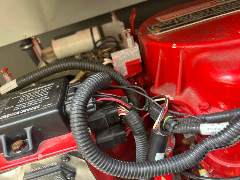 Slide: The Image of Close-up of a 2013 Monterey 260 SCR engine with red components and wiring. - 44