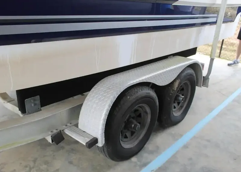 Slide: The Image of 2013 Monterey 260 SCR boat trailer with dual wheels and metal fenders. - 7
