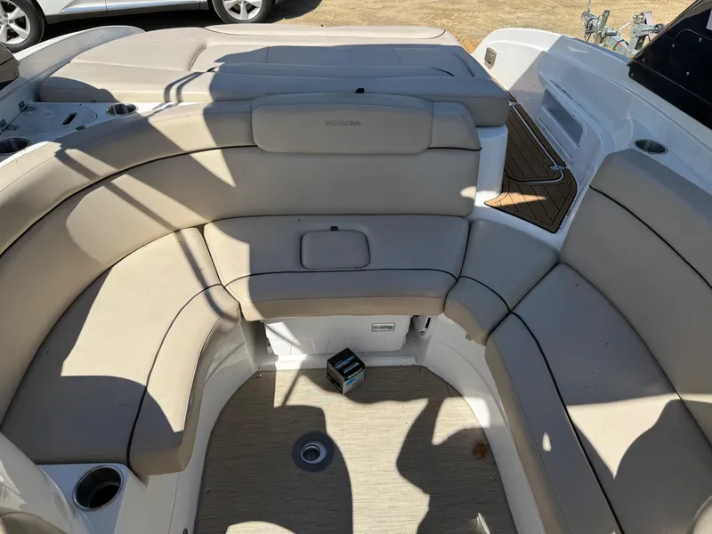 Slide: The Image of 2015 Rinker 246 Bowrider interior with beige seating and cup holders. - 4