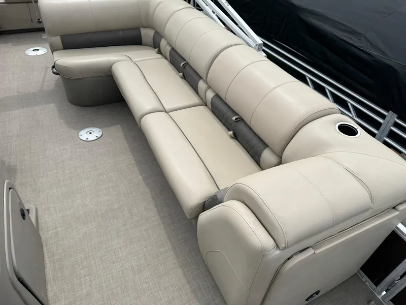 Slide: The Image of 2020 Sun Tracker Fishin' Barge 24 XP3 with beige seating and cup holder. - 11