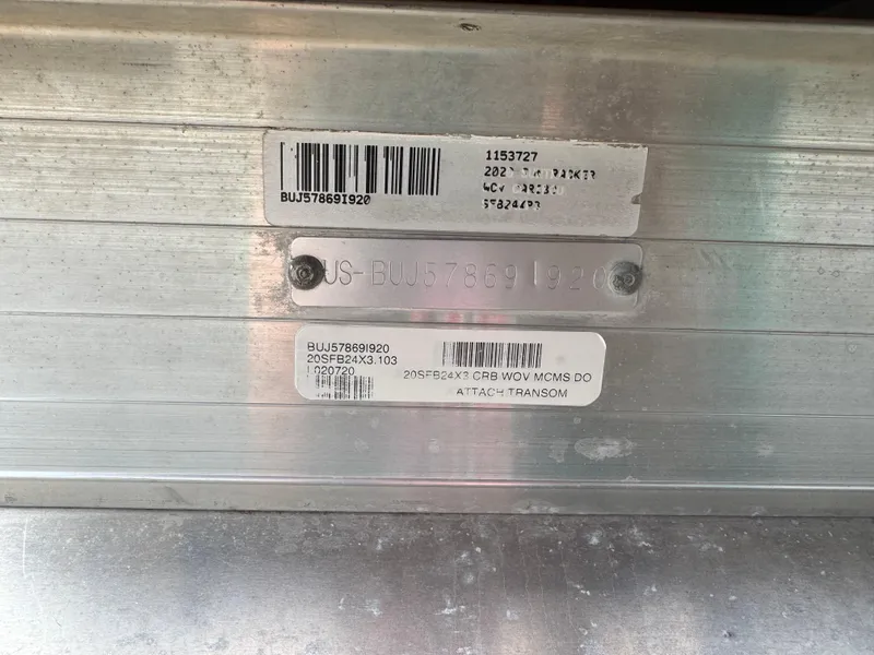 Slide: The Image of Close-up of Sun Tracker Fishin' Barge 24 XP3 2020 identification plate with barcodes. - 3