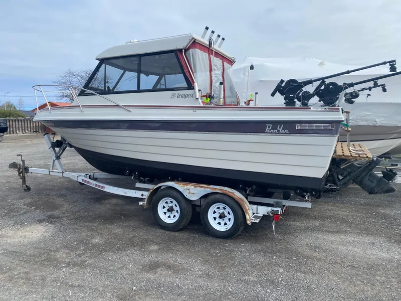 Slide: The Image of 1991 Penn Yan 215 Tempest boat on trailer, side view, outdoors. - 0