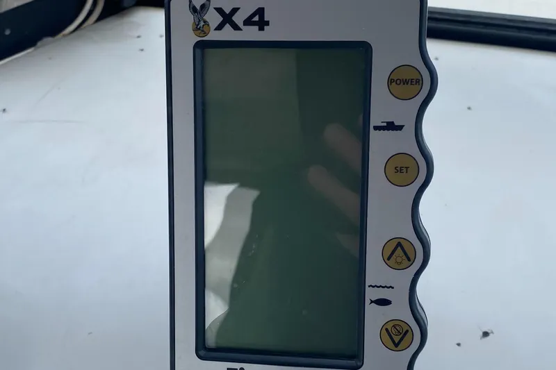 Slide: The Image of Fishfinder device on a 1991 Penn Yan 215 Tempest boat dashboard. - 15