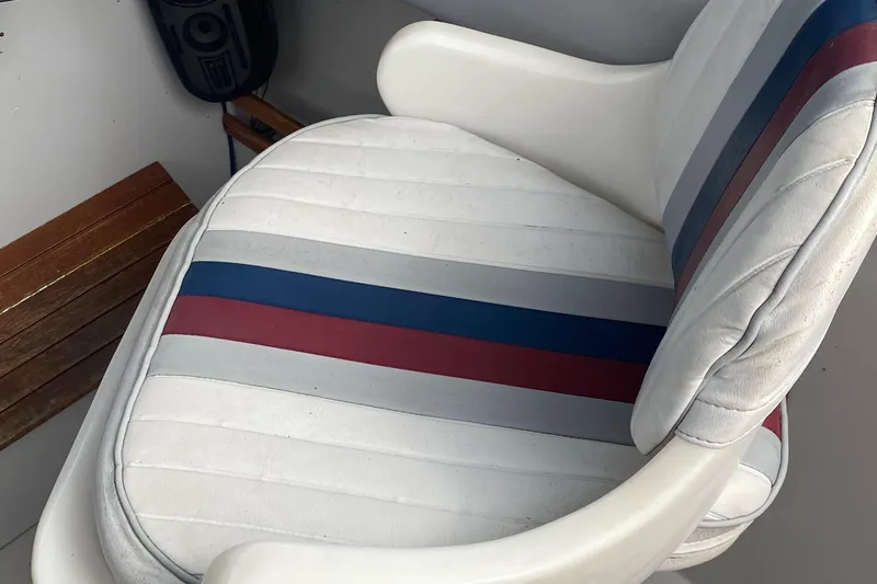 Slide: The Image of White boat seat with red and blue stripes, Penn Yan 215 Tempest, 1991 model. - 18