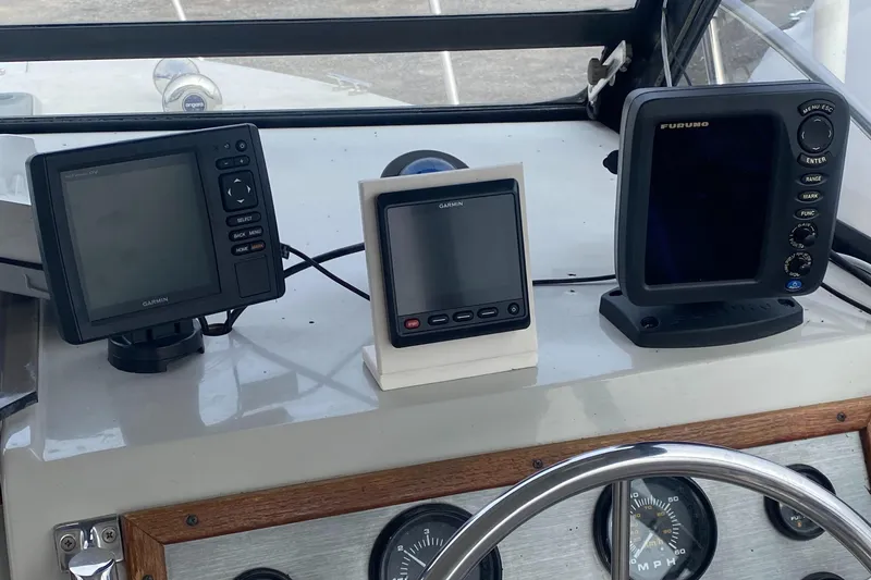 Slide: The Image of Dashboard of a 1991 Penn Yan 215 Tempest boat with navigation equipment. - 2