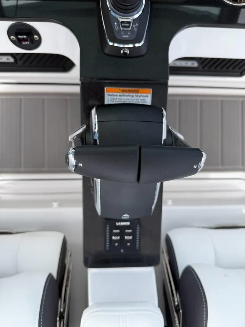 Slide: The Image of 2025 Monterey Elite 30 OB boat controls with modern dashboard and dual seating. - 10