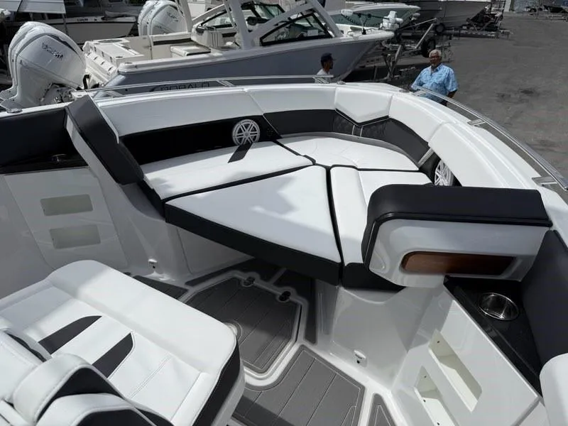 Slide: The Image of 2025 Monterey Elite 30 OB boat interior with luxurious seating and modern design. - 11