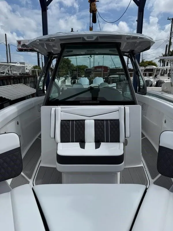 Slide: The Image of 2025 Monterey Elite 30 OB boat interior with modern seating and sleek design. - 5