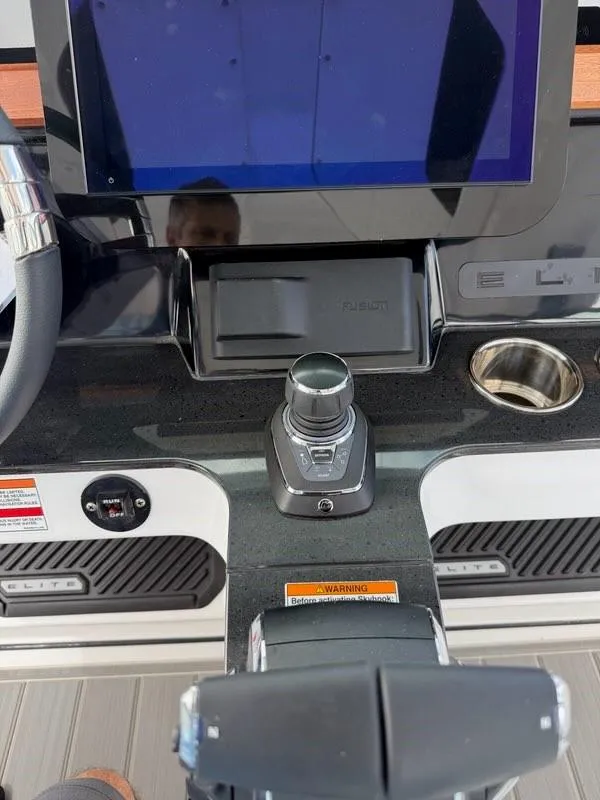 Slide: The Image of Control panel of 2025 Monterey Elite 30 OB boat with joystick and touchscreen display. - 9