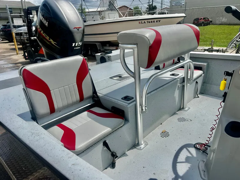 Slide: The Image of 2018 G3 Bay 18 DLX boat interior with red and gray seating, Yamaha 115 engine. - 4