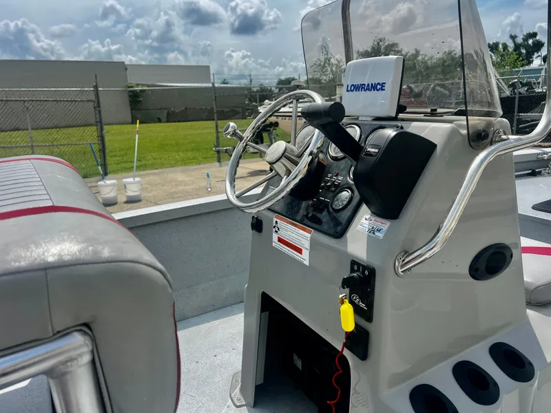 Slide: The Image of 2018 G3 Bay 18 DLX boat console with steering wheel and Lowrance navigation system. - 5