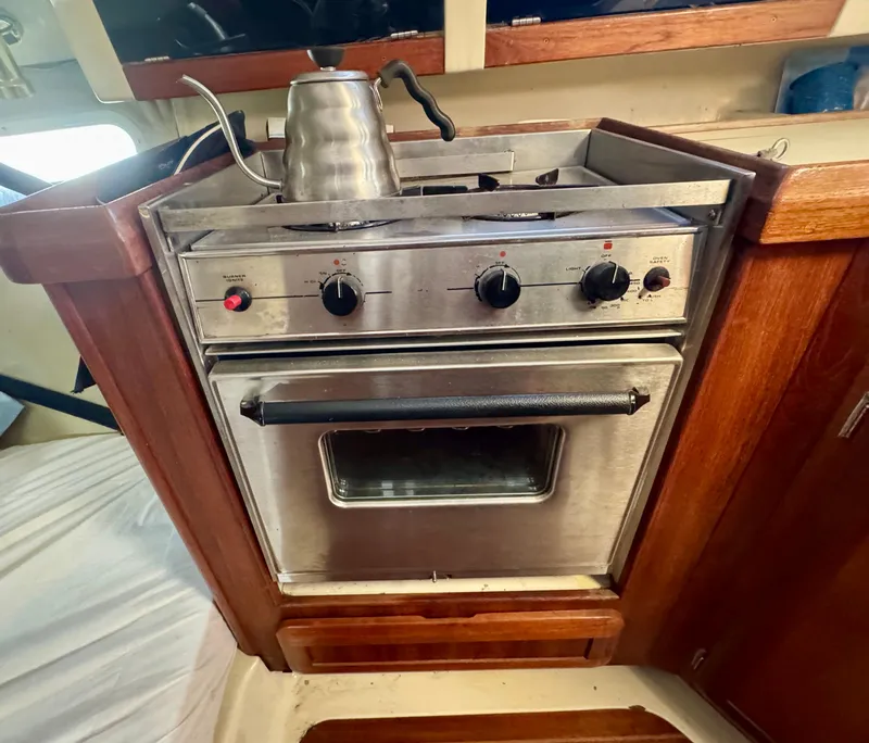 Slide: The Image of Stainless steel stove and oven in 1994 Hunter 29.5 sailboat galley. - 17