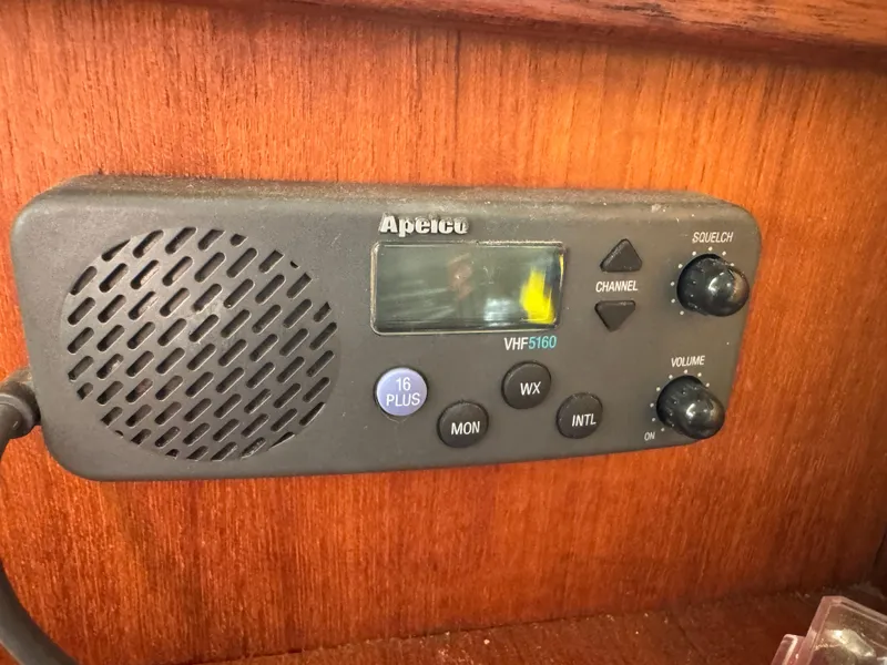Slide: The Image of VHF radio on 1994 Hunter 29.5 sailboat, mounted on wooden panel. - 19