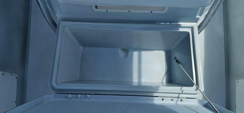 Slide: The Image of Open storage compartment on a 2002 Contender 23 Open boat. - 10