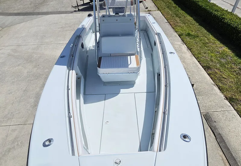 Slide: The Image of 2002 Contender 23 Open boat, top view, showcasing spacious deck and seating arrangement. - 12