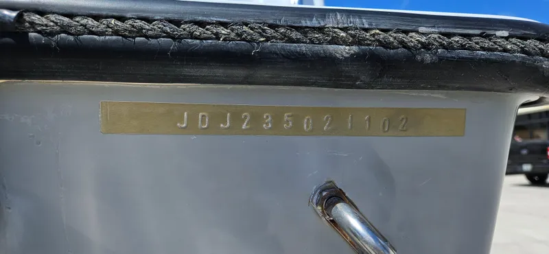 Slide: The Image of Hull identification number on a 2002 Contender 23 Open boat. - 21