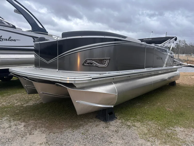 Slide: The Image of 2025 Avalon LSZ Cruise Rear Bench pontoon boat on display, featuring sleek design and modern features. - 0