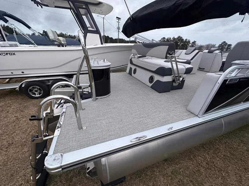 Slide: The Image of 2025 Avalon LSZ Cruise Rear Bench pontoon boat with spacious seating and sleek design. - 2