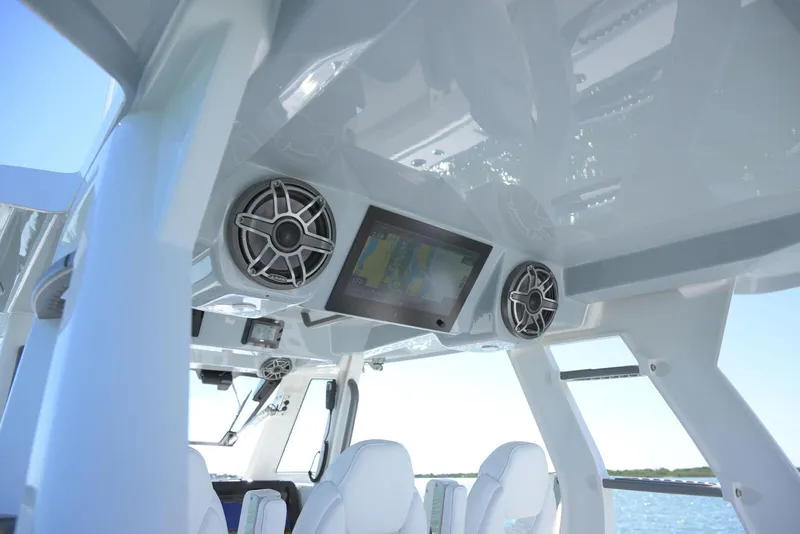 Slide: The Image of Interior of 2025 Solace 37 CS boat with speakers and navigation screen. - 13