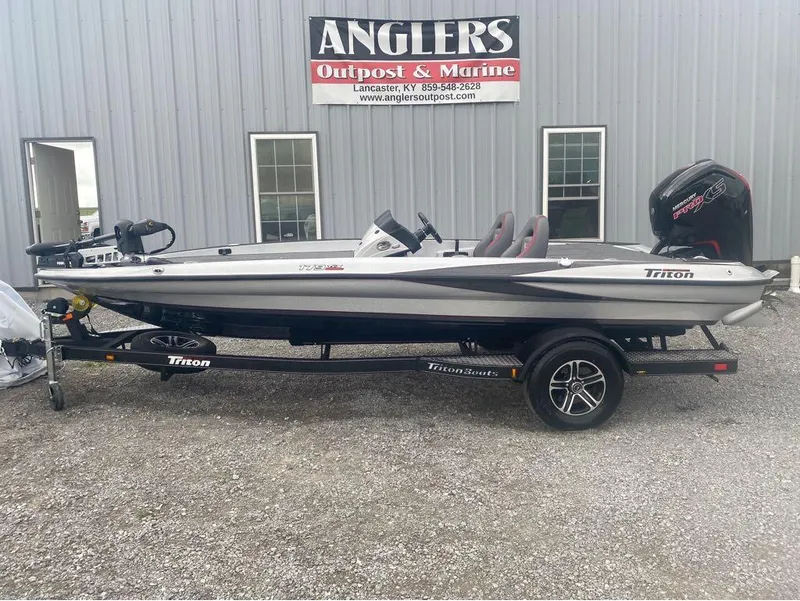 Slide: The Image of 2024 Triton 179 TrX boat on trailer at Angler's Outpost & Marine dealership. - 3