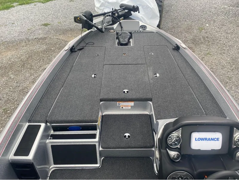 Slide: The Image of 2024 Triton 179 TrX boat deck with Lowrance electronics and trolling motor. - 4