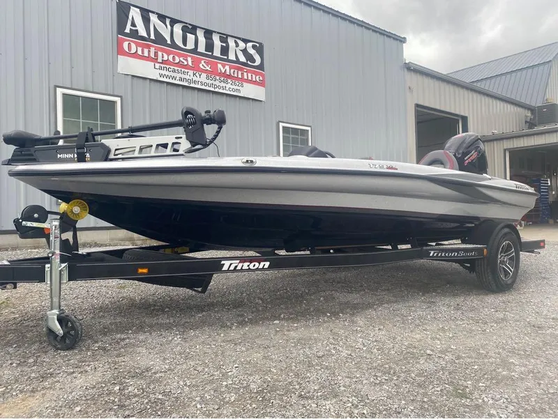 Slide: The Image of 2024 Triton 179 TrX boat on trailer at Anglers Outpost & Marine dealership. - 6