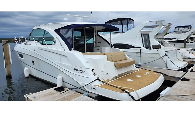Slide: The Image of 2014 Cruisers Yachts 41 Cantius docked, featuring sleek design and spacious deck. - 0