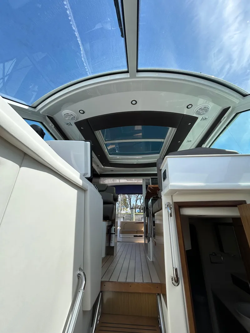 Slide: The Image of Interior view of 2014 Cruisers Yachts 41 Cantius with glass ceiling and modern design. - 11