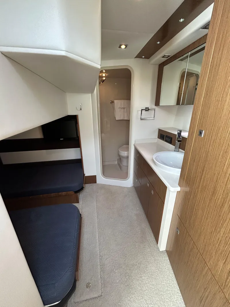Slide: The Image of 2014 Cruisers Yachts 41 Cantius interior with modern bathroom and cozy sleeping area. - 12