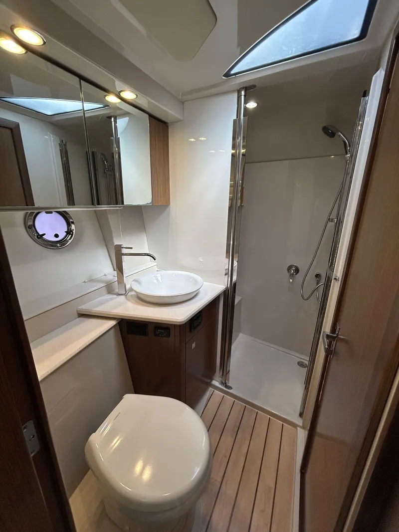 Slide: The Image of Luxurious bathroom in 2014 Cruisers Yachts 41 Cantius with modern fixtures and shower. - 13