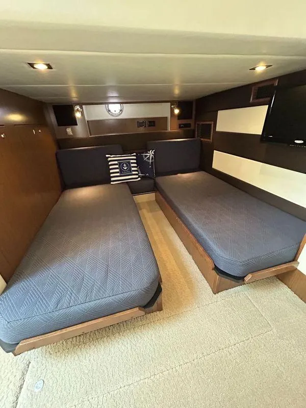 Slide: The Image of 2014 Cruisers Yachts 41 Cantius cabin with twin beds and nautical decor. - 14