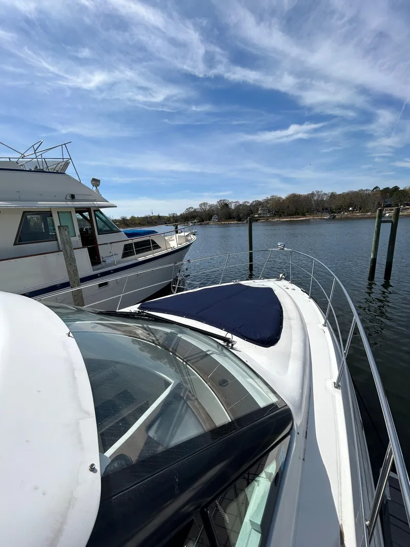 Slide: The Image of 2014 Cruisers Yachts 41 Cantius docked on a sunny day with blue skies. - 19