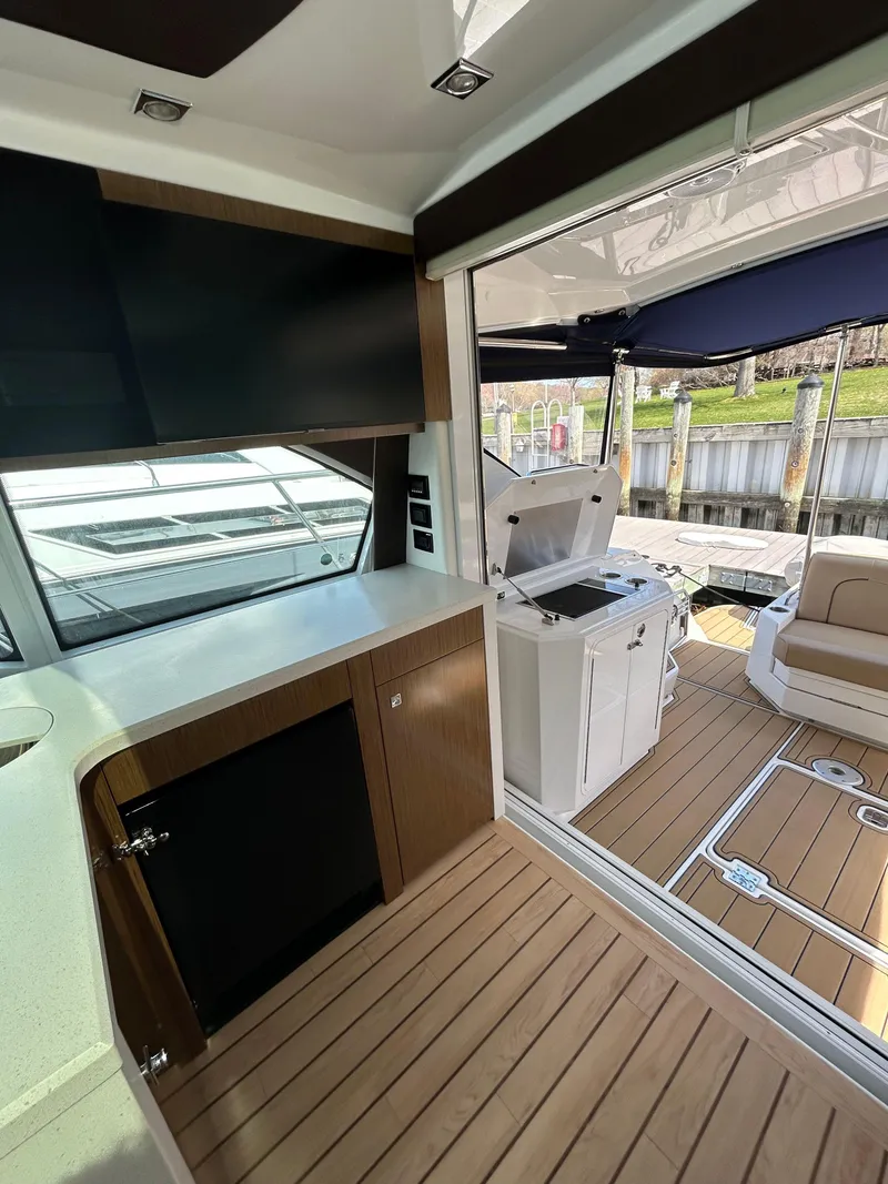 Slide: The Image of 2014 Cruisers Yachts 41 Cantius interior with modern design and spacious deck area. - 8