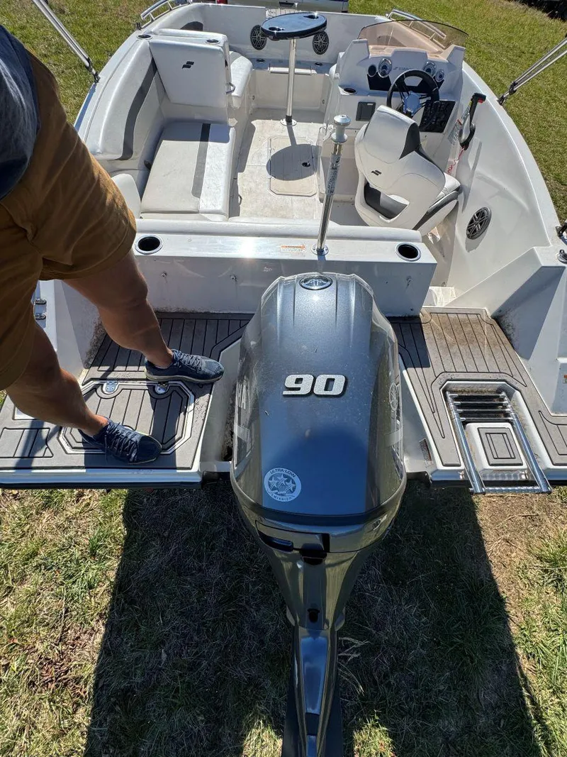 Slide: The Image of 2022 Starcraft SVX 171 OB boat with 90 HP engine, interior view from rear. - 3